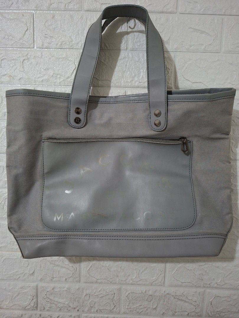 Marc by Marc Jacobs Grey Canvas Tote Bag (Category: Luxury Bags & Wallets) located in Caloocan City. Submitted by mamayche (Listing ID 1460654405, Image 1). Description: - Brand: Marc Jacobs - Type: Tote Bag and Sling Bag - Color: Grey -Used but not abused.