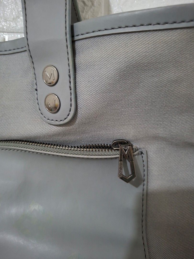 Marc by Marc Jacobs Grey Canvas Tote Bag (Category: Luxury Bags & Wallets) located in Caloocan City. Submitted by mamayche (Listing ID 1460654405, Image 2). Description: - Brand: Marc Jacobs - Type: Tote Bag and Sling Bag - Color: Grey -Used but not abused.