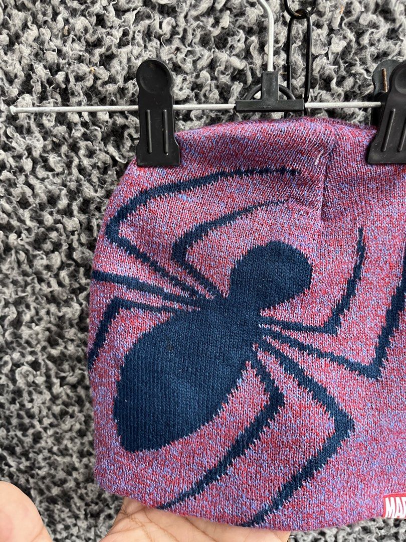 Marvel Spider-Man knit beanie (Category: Beanies) located in General Trias. Submitted by zrchustle.604 (Listing ID 1460677406, Image 3). Description: Marvel Spider-Man knit beanie featuring a dark spider graphic on a pinkish-red marled knit background with a small Marvel tag at the bottom edge..