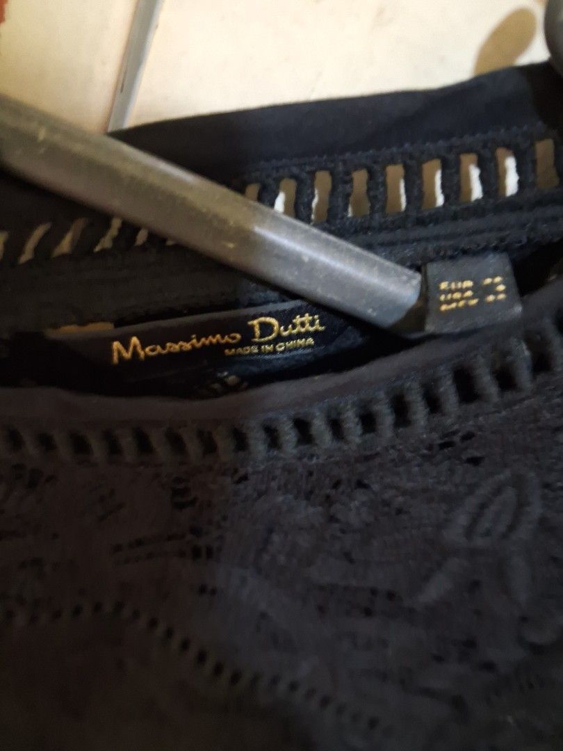 Massimo Dutti Black Lace Button-Up Long Sleeve Blouse (Category: Blouses) located in Santa Maria. Submitted by bax19 (Listing ID 1460583935, Image 2). Description: - Brand: Massimo Dutti - Color: Black - Material: Lace - Style: Button-up blouse - Sleeves: Long sleeves - Details: Floral pattern with cut-out details on neckline, cuffs, and hem - Versatility: Perfect for layering or wearing on its own, dress up or down.