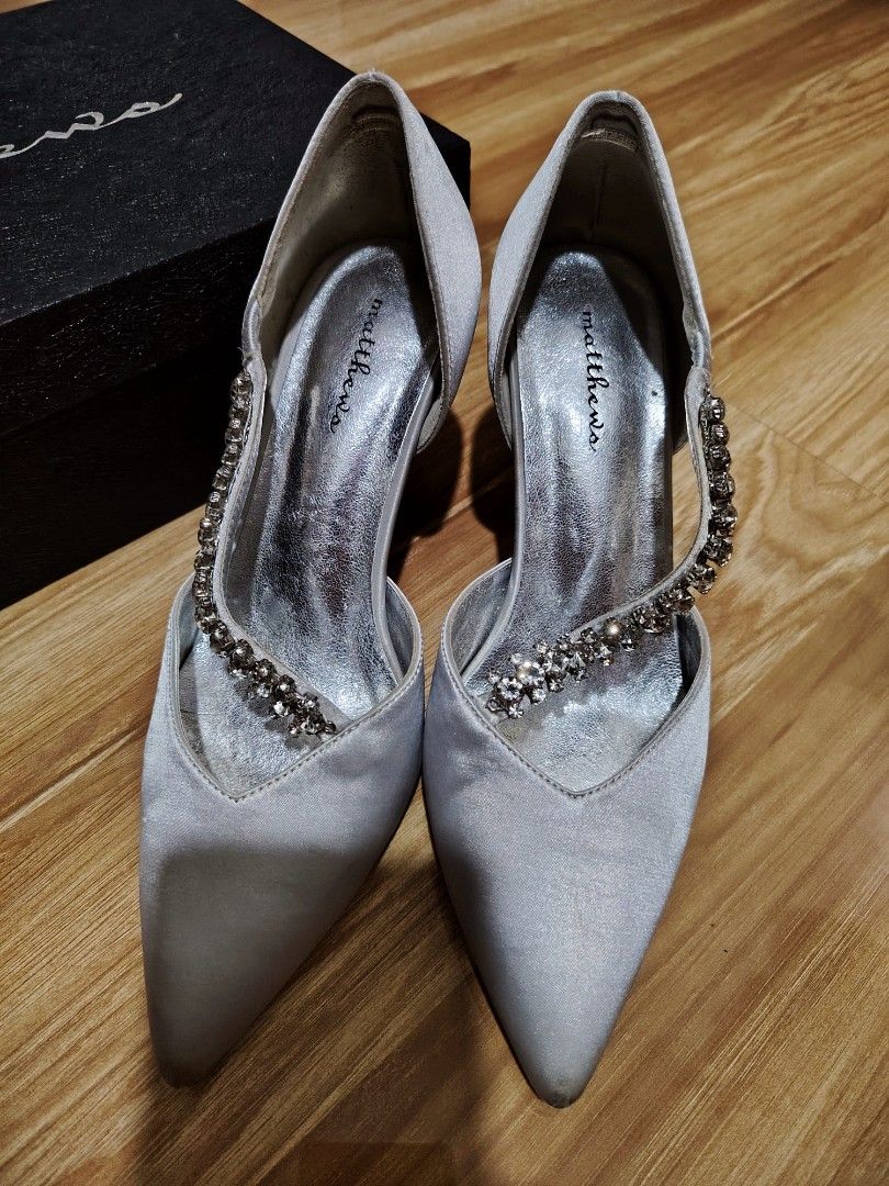 Matthews Silver Heels with Box Size 37 (Category: Heels) located in Malabon City. Submitted by jessa.sioson (Listing ID 1460686698, Image 2). Description: Selling preloved - Matthews heels in a light silver color. - Features a chic pointed toe. - Elegant strap across the foot with sparkly embellishments. - Size 37. - Comes with the original Matthews box. - Ideal for formal events, parties, or weddings..