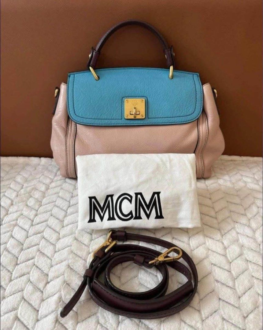 MCM Bag (Category: Luxury Bags & Wallets) located in Quezon City. Submitted by liezl.marie (Listing ID 1460659310, Image 1). Description: M(M two-tone leather top-handle satchel bag in light pink and blue with gold-tone hardware and a matching detachable shoulder strap. 7,500 Open for layaway. Disclaimer: We are not affiliated, associated, authorized, endorsed by or in any way officially connected with any other company or luxury brand. All copyr