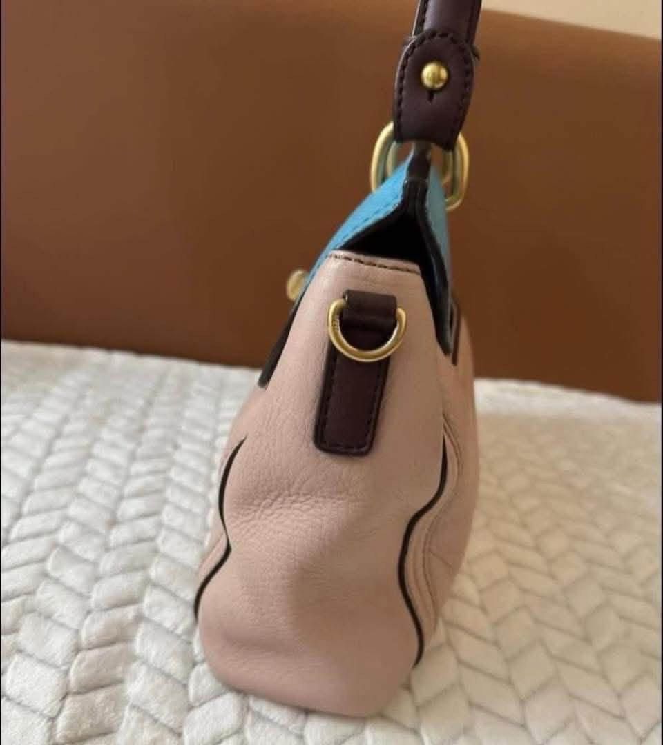 MCM Bag (Category: Luxury Bags & Wallets) located in Quezon City. Submitted by liezl.marie (Listing ID 1460659310, Image 3). Description: M(M two-tone leather top-handle satchel bag in light pink and blue with gold-tone hardware and a matching detachable shoulder strap. 7,500 Open for layaway. Disclaimer: We are not affiliated, associated, authorized, endorsed by or in any way officially connected with any other company or luxury brand. All copyr