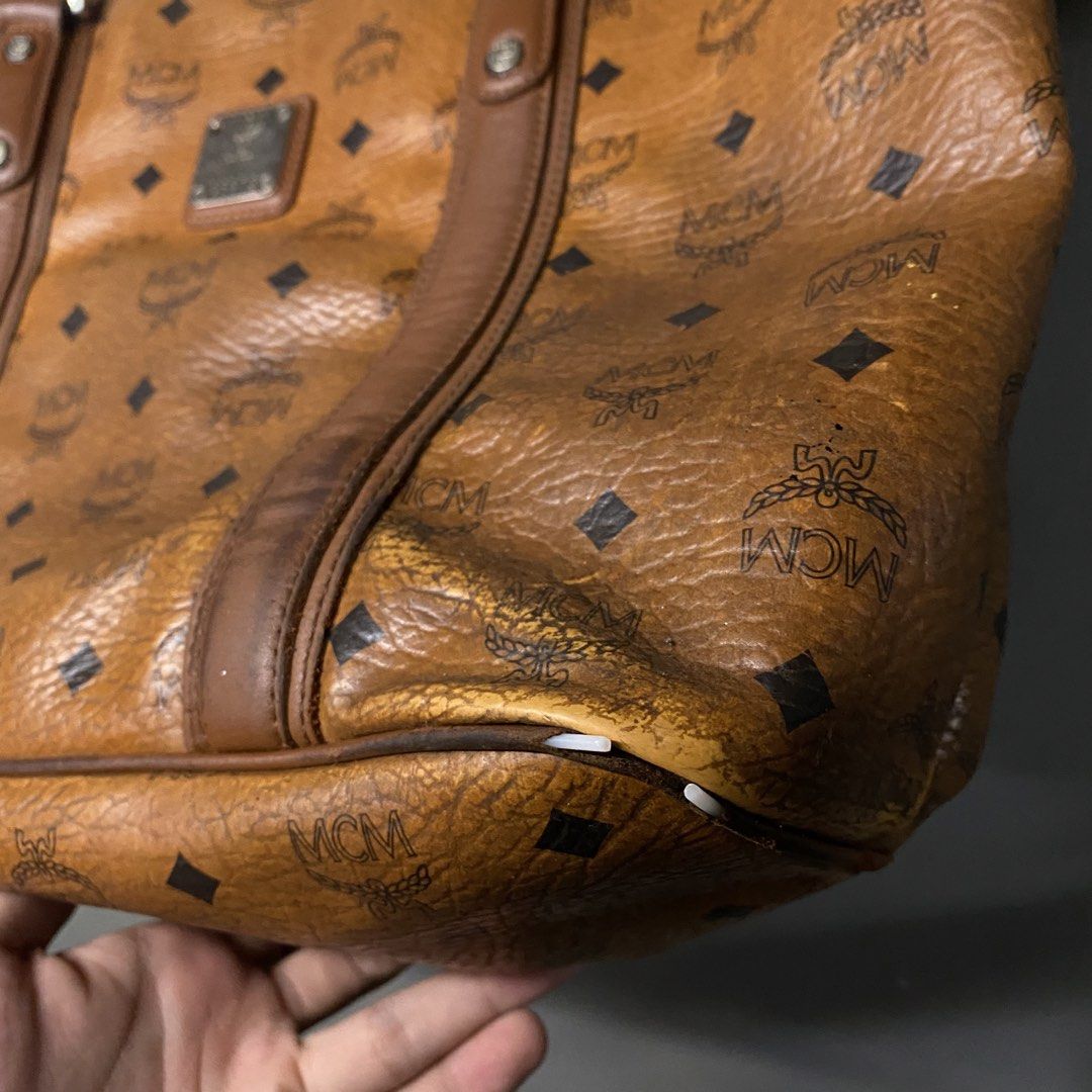 MCM Monogram Tote Bag Brown Leather (Category: Luxury Bags & Wallets) located in Cagayan de Oro. Submitted by sumamestreethub (Listing ID 1460612021, Image 3). Description: - Classic MCM tote bag - All-over brown monogram print - Leather trim and handles - Interior zippered pocket and slip pockets - Some wear on bottom corners and edges - Interior is clean - Great everyday bag.