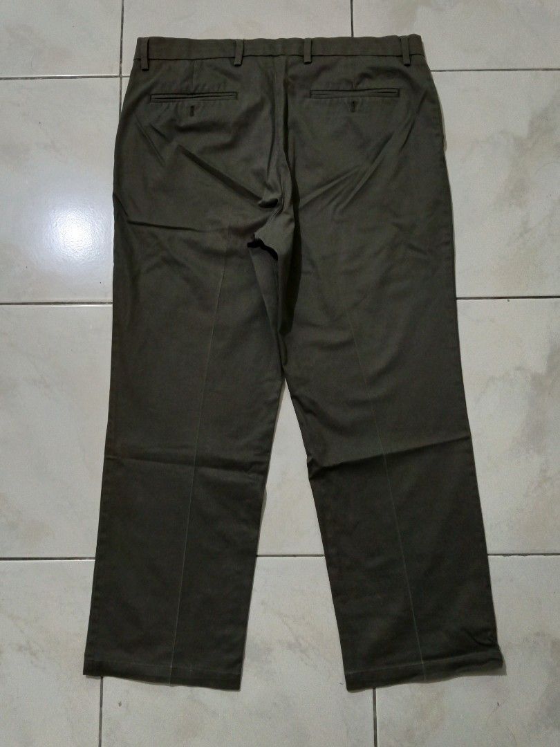 Men's Khaki Chinos Trousers (Category: Trousers) located in Manila. Submitted by nostalgic.curated (Listing ID 1460512953, Image 2). Description: - Classic khaki chinos for men - Straight leg fit - Two back pockets - Button and zip closure - Comfortable for everyday wear - Versatile for casual or smart casual outfits.
