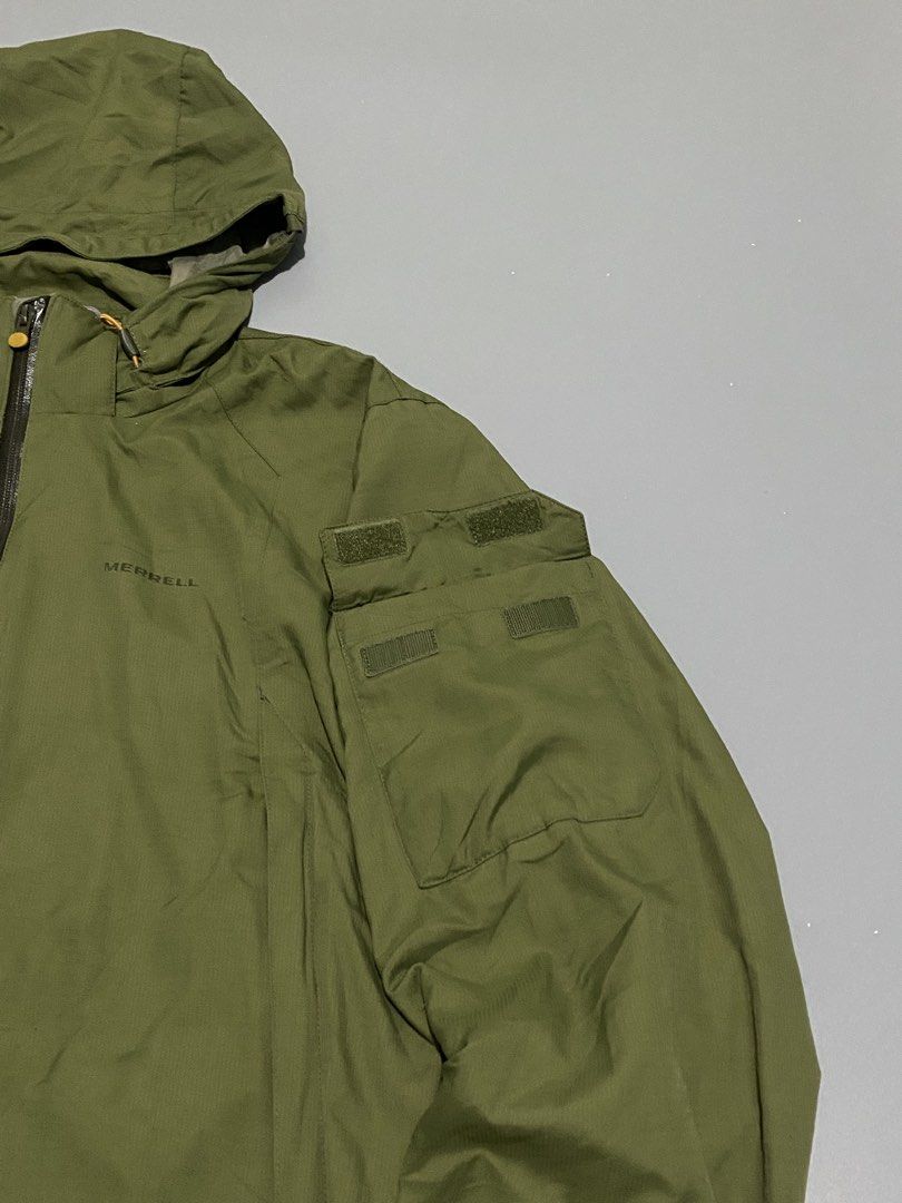 Merrell Olive Green Hooded Jacket (Category: Coats, Jackets and Outerwear) located in Mandaue City. Submitted by dfindss. (Listing ID 1460682868, Image 3). Description: - Olive green Merrell hooded jacket - Full zip front closure - Multiple chest and sleeve pockets (chest pockets appear to have velcro closures) - Adjustable drawstring hem - Ideal for outdoor activities and casual wear.