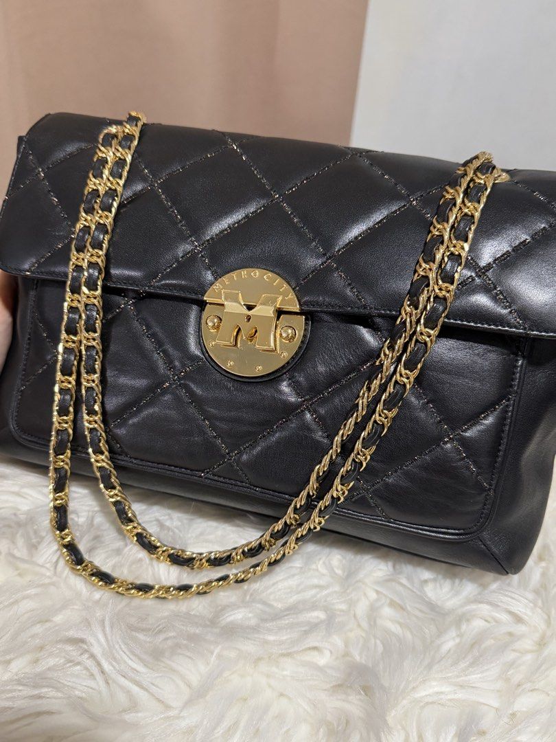 Metrocity Chain Sling Bag (Category: Shoulder Bags) located in Marikina City. Submitted by welllovedbycarina (Listing ID 1460544784, Image 2). Description: Original Metrocity, preowned from Korea Color is black, with glittered threads effect ✨ So pretty 😍 Gold tone hardware Ready to ship from Marikina City Medium Size Dimensions: (atleast) 30cm x 17cm x 11cm BAG CONDITION • Overall Condition: Excellent • Leather/Material: Excellent • Corners & E