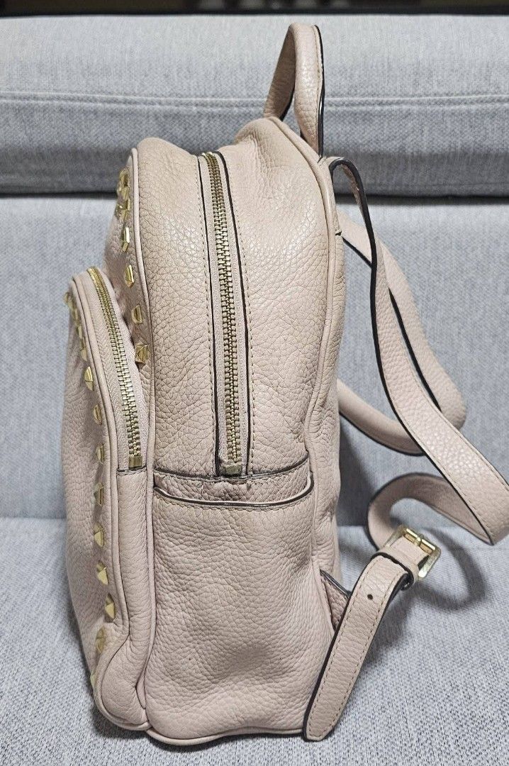 Michael Kors Abbey light pink backpack (Category: Backpacks) located in Tuguegarao City. Submitted by bili_naph (Listing ID 1460525332, Image 3). Description: ☆ Michael Kors Abbey light pink ☆ Studded pebbled leather backpack ☆ Featuring distinctive gold-tone pyramid hardware along the front and trim ☆ Medium size ☆ With adjustable straps ☆ Normal sign of use ☆ No major flaw ☆ BN retails for P18k to P26k ☆ Steal at P1,650.00.