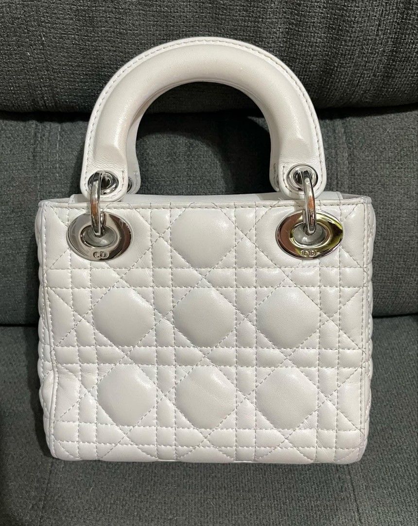 Mini CD (Category: Shoulder Bags) located in Quezon City. Submitted by luxxechic (Listing ID 1460699885, Image 2). Description: coded CD under zip with complete charm pure leather looks new no issue japan preloved actual phito posted mop: gcash.