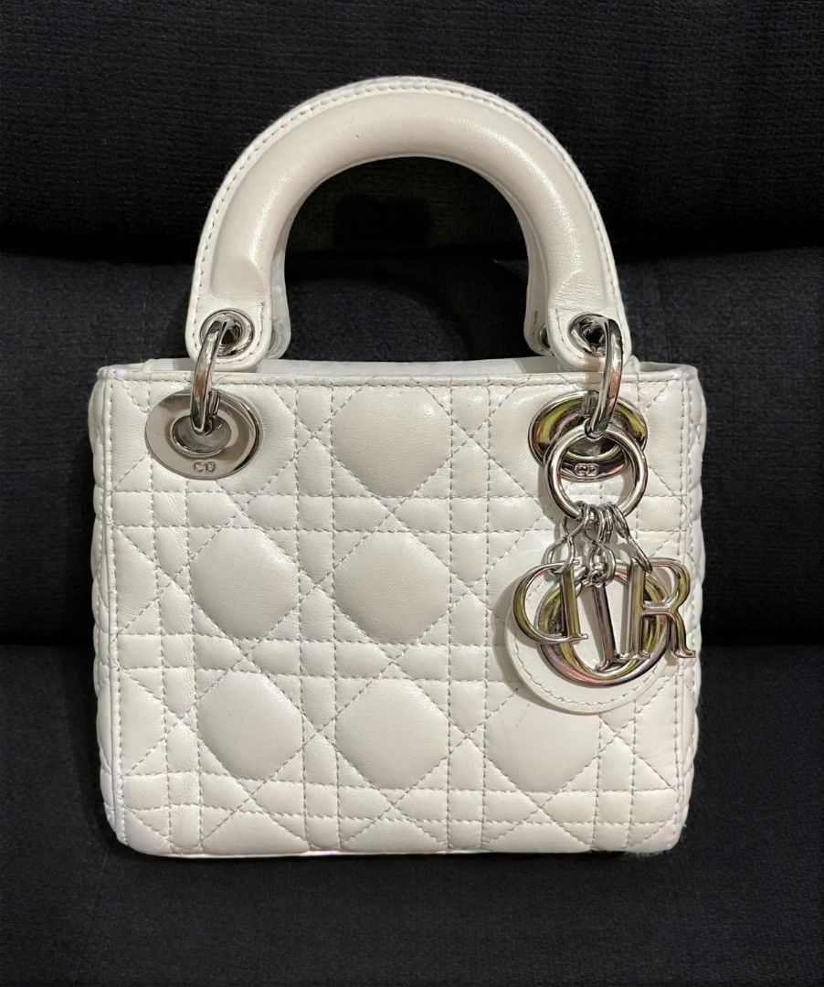 Mini CD (Category: Shoulder Bags) located in Quezon City. Submitted by luxxechic (Listing ID 1460699885, Image 1). Description: coded CD under zip with complete charm pure leather looks new no issue japan preloved actual phito posted mop: gcash.