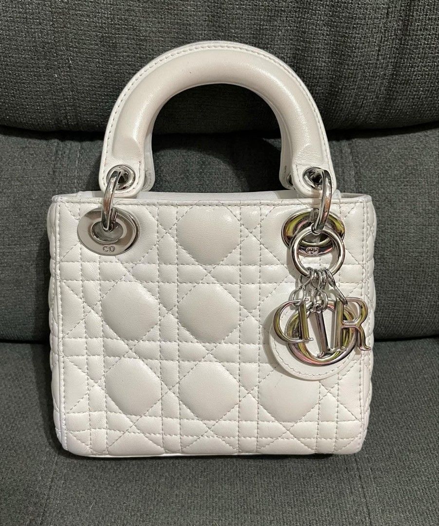 Mini CD (Category: Shoulder Bags) located in Quezon City. Submitted by luxxechic (Listing ID 1460699885, Image 3). Description: coded CD under zip with complete charm pure leather looks new no issue japan preloved actual phito posted mop: gcash.