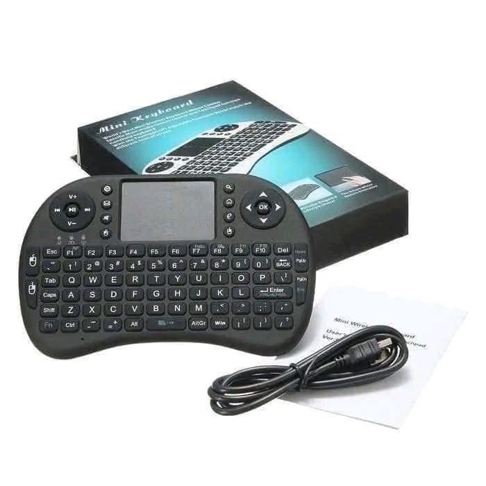Mini i8 Wireless Touchpad Keyboard with USB Receiver (Category: Computer Keyboard) located in Manila. Submitted by marvieobordo (Listing ID 1460520933, Image 1). Description: - Mini wireless keyboard with integrated touchpad - Compatible with laptops, desktops, smart TVs, Android boxes, and more - Standard QWERTY layout - Dedicated media control keys - Includes USB receiver and charging cable - Ideal for presentations and remote media control - P