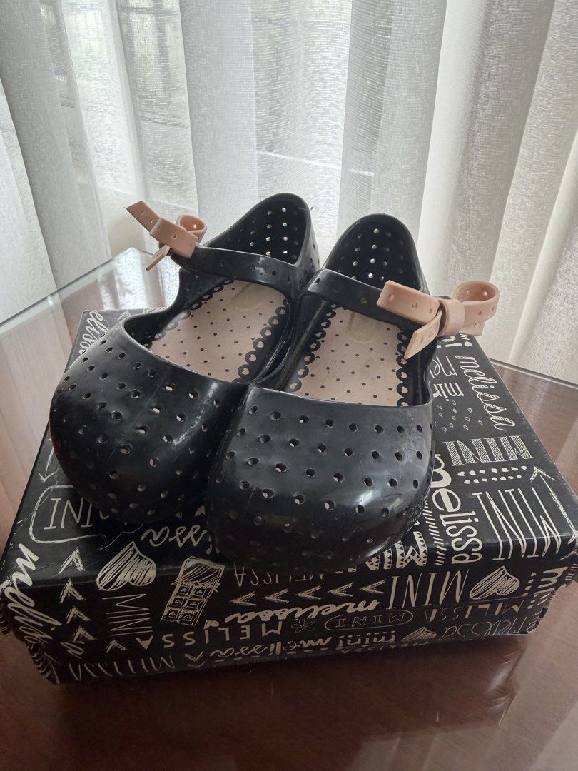 Mini Melissa (Category: Babies & Kids Fashion) located in Las Pinas. Submitted by karensalingarog (Listing ID 1460554955, Image 1). Description: - Mini Melissa Black Jelly Mary Jane Shoes - Size US 8 - Adorable perforated design - Sweet bow detail on strap - Comes with original box - Proudly made in Brazil.