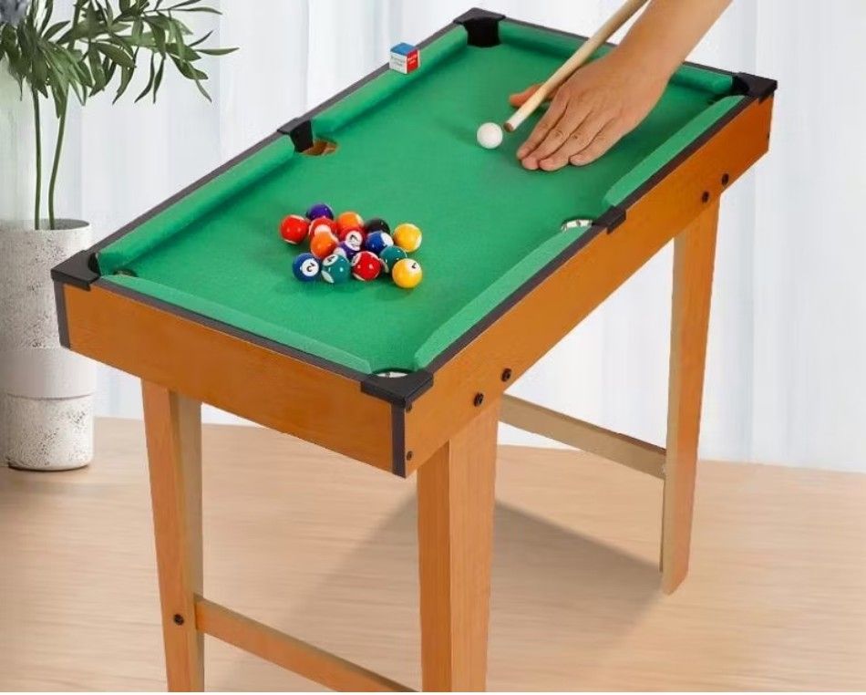 Mini Tabletop Pool Billiard Game Set with Accessories (Category: Kids Toys) located in Caloocan City. Submitted by oettam (Listing ID 1460557737, Image 1). Description: mini billiard wooden for kids complete set. no issue and complete tools ready to ship. RFS seldom use - Compact pool table for fun anywhere. - Includes all balls, cues, and rack. - Great for kids or a quick game. - Folds up for easy storage. - Perfect for game nights or small spac