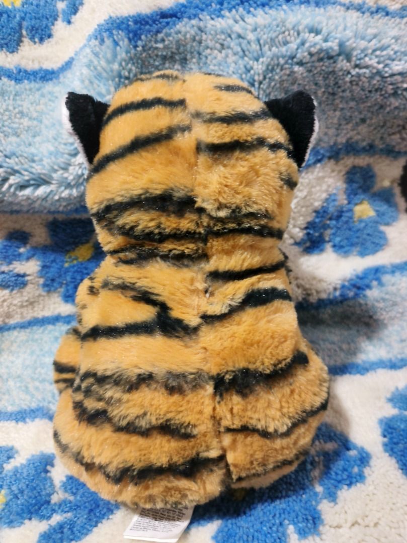 Miniso Tiger Plush Toy 22cm (Category: Plushies & Soft Toys) located in San Leonardo. Submitted by burgossanleonardo.12345 (Listing ID 1460622349, Image 3). Description: - Adorable Miniso tiger plush toy - Size: 22cm (8.7 inches) - Material: 100% Polyester - Ideal for kids and collectors - Super soft and cuddly - Looking for a new loving home!.
