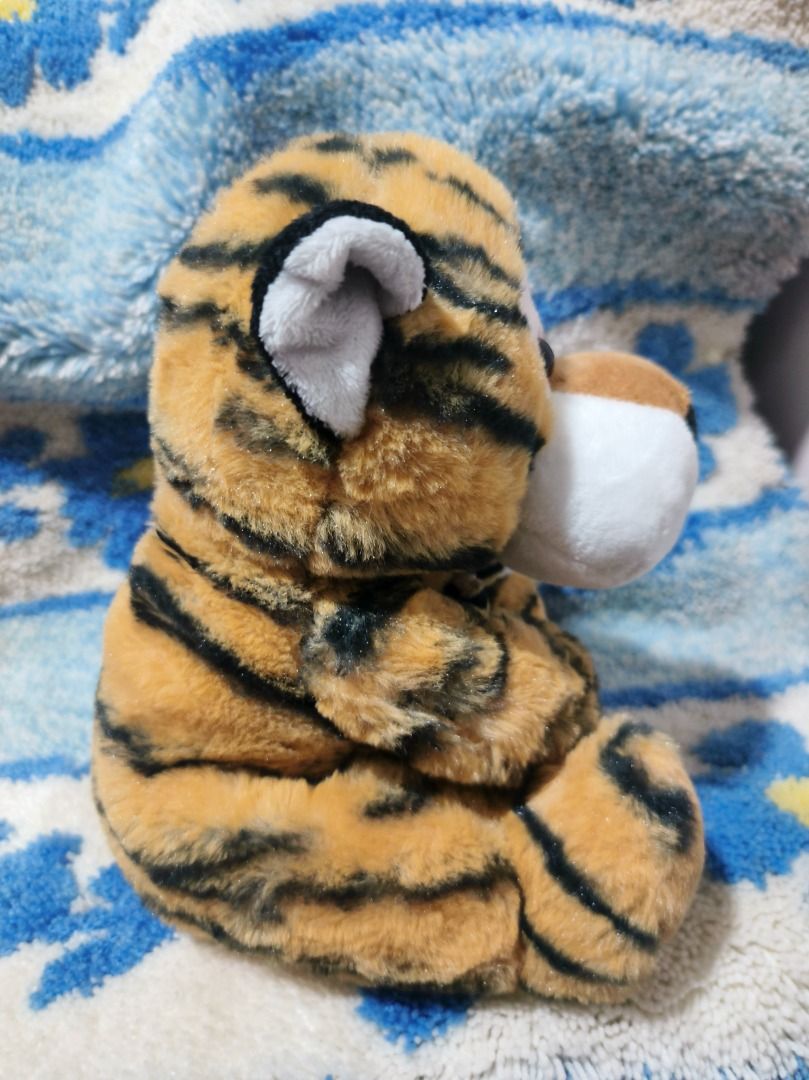 Miniso Tiger Plush Toy 22cm (Category: Plushies & Soft Toys) located in San Leonardo. Submitted by burgossanleonardo.12345 (Listing ID 1460622349, Image 2). Description: - Adorable Miniso tiger plush toy - Size: 22cm (8.7 inches) - Material: 100% Polyester - Ideal for kids and collectors - Super soft and cuddly - Looking for a new loving home!.