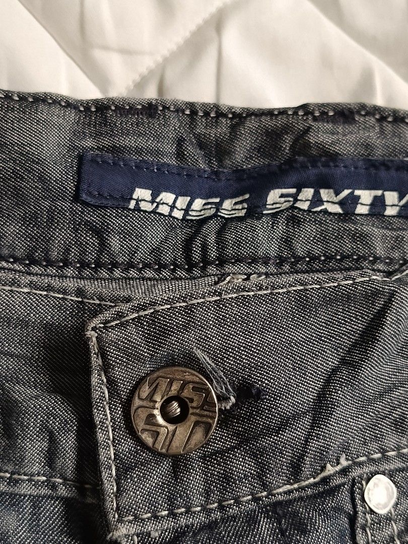 Miss Sixty Denim Shorts Size 26 (Category: Shorts) located in Cebu City. Submitted by vionchan (Listing ID 1460552488, Image 2). Description: - Miss Sixty Denim Shorts - Size: 26-30 - Color: Dark Wash - Details: White stitching, zippered front pockets - Closure: Button and zip - Material: 100% Cotton - Style: Casual wear.