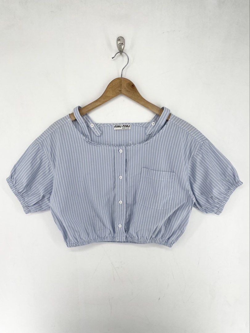 Miumiu Chrambray Stripe Distressed Crop Top (Category: Blouses) located in Mandaluyong City. Submitted by armrhts (Listing ID 1460618034, Image 1). Description: Size: Medium Dimensions(inches) •Width: 21" •Length: 15" •Pit to Cuff: 6".
