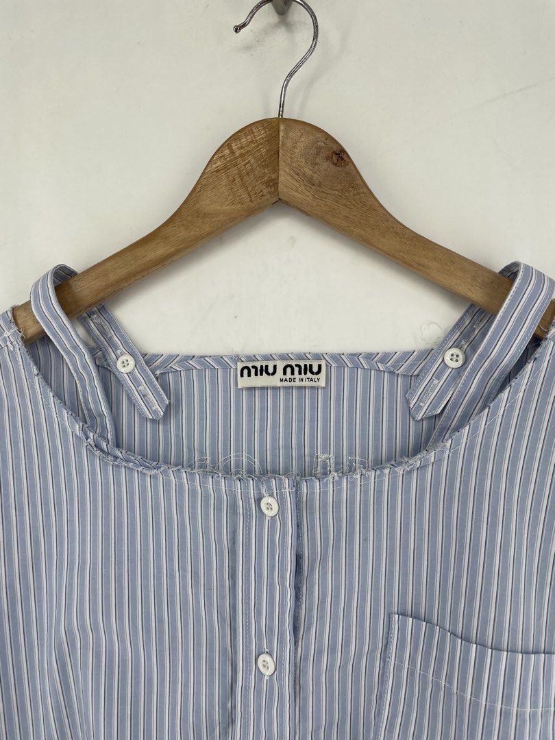 Miumiu Chrambray Stripe Distressed Crop Top (Category: Blouses) located in Mandaluyong City. Submitted by armrhts (Listing ID 1460618034, Image 3). Description: Size: Medium Dimensions(inches) •Width: 21" •Length: 15" •Pit to Cuff: 6".
