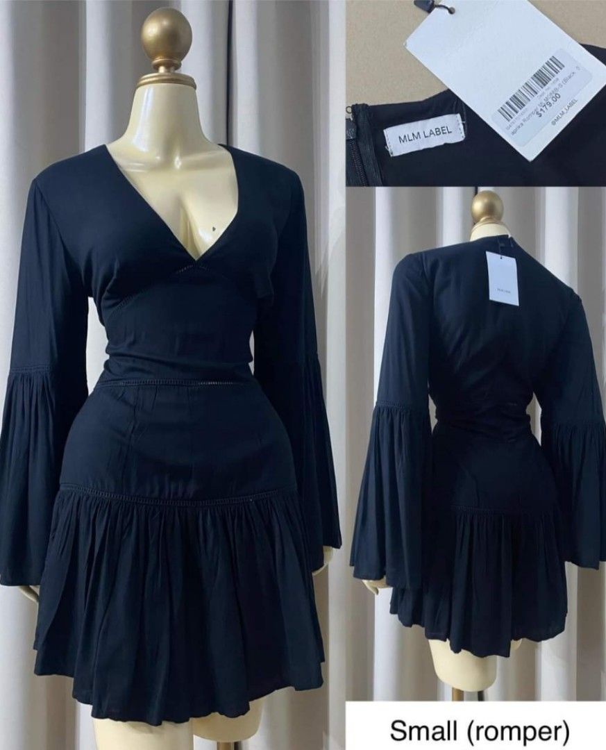 MLM LABEL Black Bell Sleeve Romper (Category: Rompers) located in Antipolo. Submitted by hesedfinds.shop (Listing ID 1460597709, Image 1). Description: Black romper with bell sleeves. V-neckline and ruffled hem. Zipper closure at the back. Size small up to medium. Great for a night out or a special occasion..