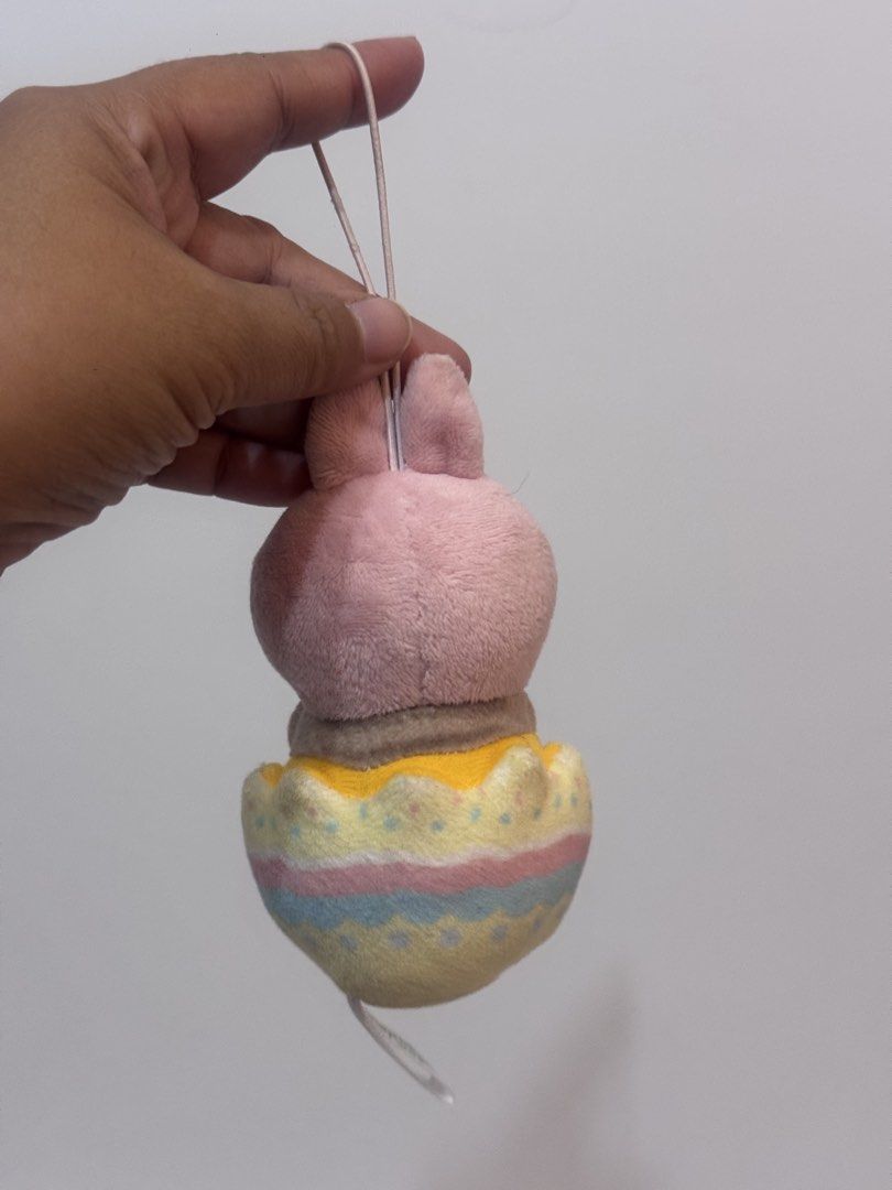 Mofusand Easter Nyan plush charm (Category: Plushies & Soft Toys) located in Antipolo. Submitted by bhabiegraciefashionlab (Listing ID 1460533224, Image 3). Description: mofusand Easter Nyan plush mascot by FuRyu, showing a small cat in a pink bunny hood inside a pastel egg. Product Details 🐱Character: mofusand cat 🐱Design: Cat wearing a pink rabbit hood 🐱Container: Colorful Easter egg base with a hanging strap 🐱Size: About 8 centimeters 🐱Ma