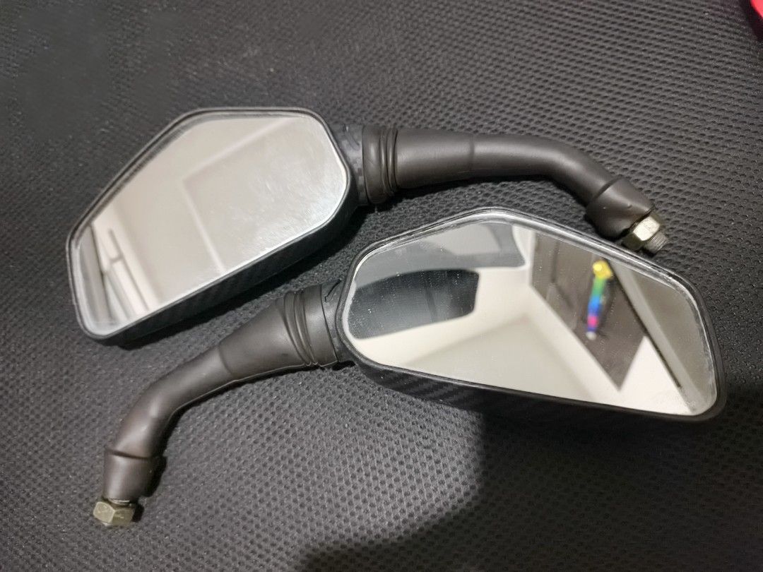 Motorcycle Side Mirrors with Carbon Fiber Look (Category: Other Motorcycles Parts and Accessories) located in Tuguegarao City. Submitted by domzaiii (Listing ID 1460647536, Image 2). Description: - Pair of motorcycle side mirrors - Black stems with carbon fiber pattern housing - Rectangular shape with rounded corners - Universal fit for most motorcycles - Mounting bolts included - Please check your bike's mounting size before purchasing.
