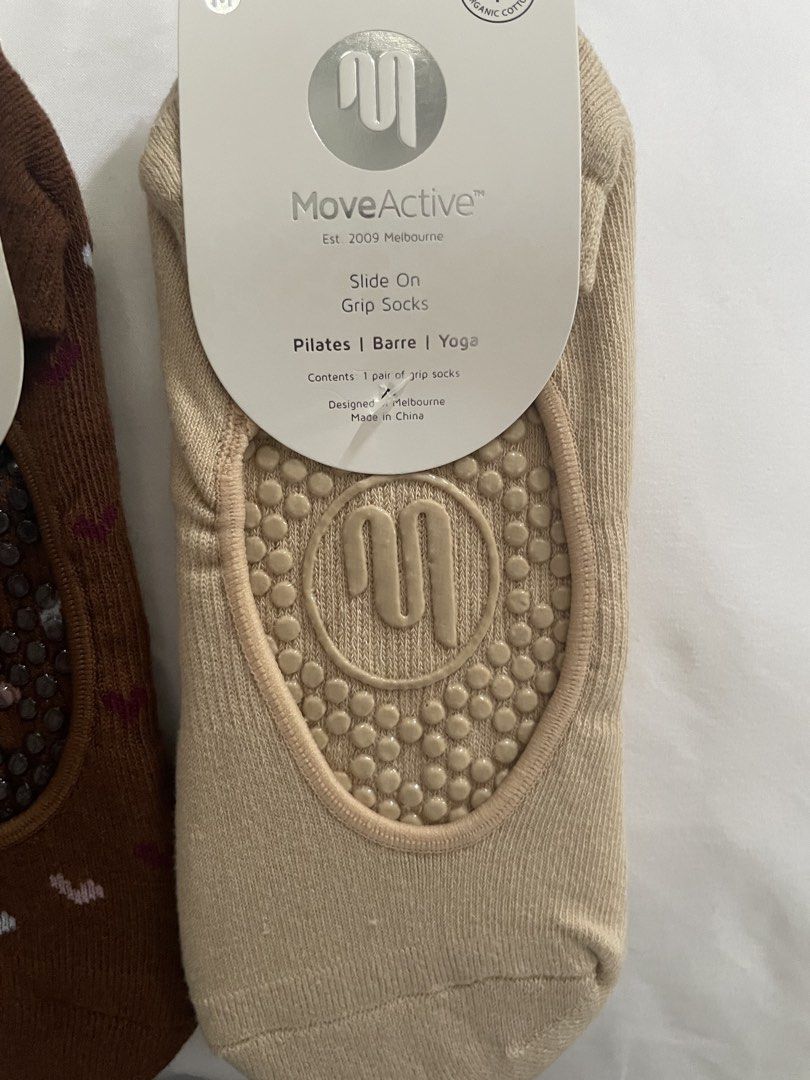 MoveActive Slide On Grip Socks (Medium) (Category: Socks & Tights) located in Muntinlupa City. Submitted by afs77 (Listing ID 1460551021, Image 3). Description: - MoveActive Grip Socks -P1,200 for both (SRP 1,000 each) - Size: Medium (M) fits US size 8-10 - Style: Slide-on - Perfect for: Pilates, Barre, Yoga - Material: Certified Organic Cotton - Design Origin: Melbourne - Colors: Brown (subtle heart pattern), Beige - Feature: Enhanced grip for w