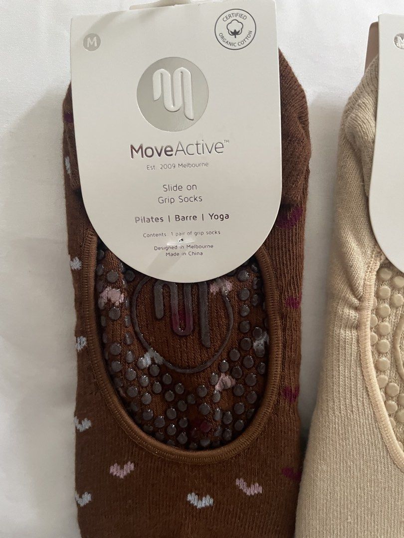MoveActive Slide On Grip Socks (Medium) (Category: Socks & Tights) located in Muntinlupa City. Submitted by afs77 (Listing ID 1460551021, Image 2). Description: - MoveActive Grip Socks -P1,200 for both (SRP 1,000 each) - Size: Medium (M) fits US size 8-10 - Style: Slide-on - Perfect for: Pilates, Barre, Yoga - Material: Certified Organic Cotton - Design Origin: Melbourne - Colors: Brown (subtle heart pattern), Beige - Feature: Enhanced grip for w