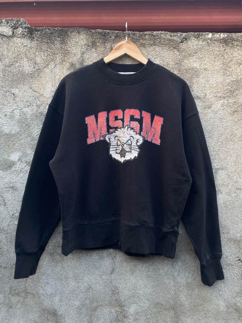 MSGM Black Sweatshirt with Cat Graphic - Size M (Category: Coats, Jackets and Outerwear) located in Bansalan. Submitted by thriftyzzz (Listing ID 1460683407, Image 1). Description: - Black MSGM sweatshirt - Features iconic MSGM logo with distressed cat graphic - Made in Italy - Tag size: M - Ideal for casual wear.