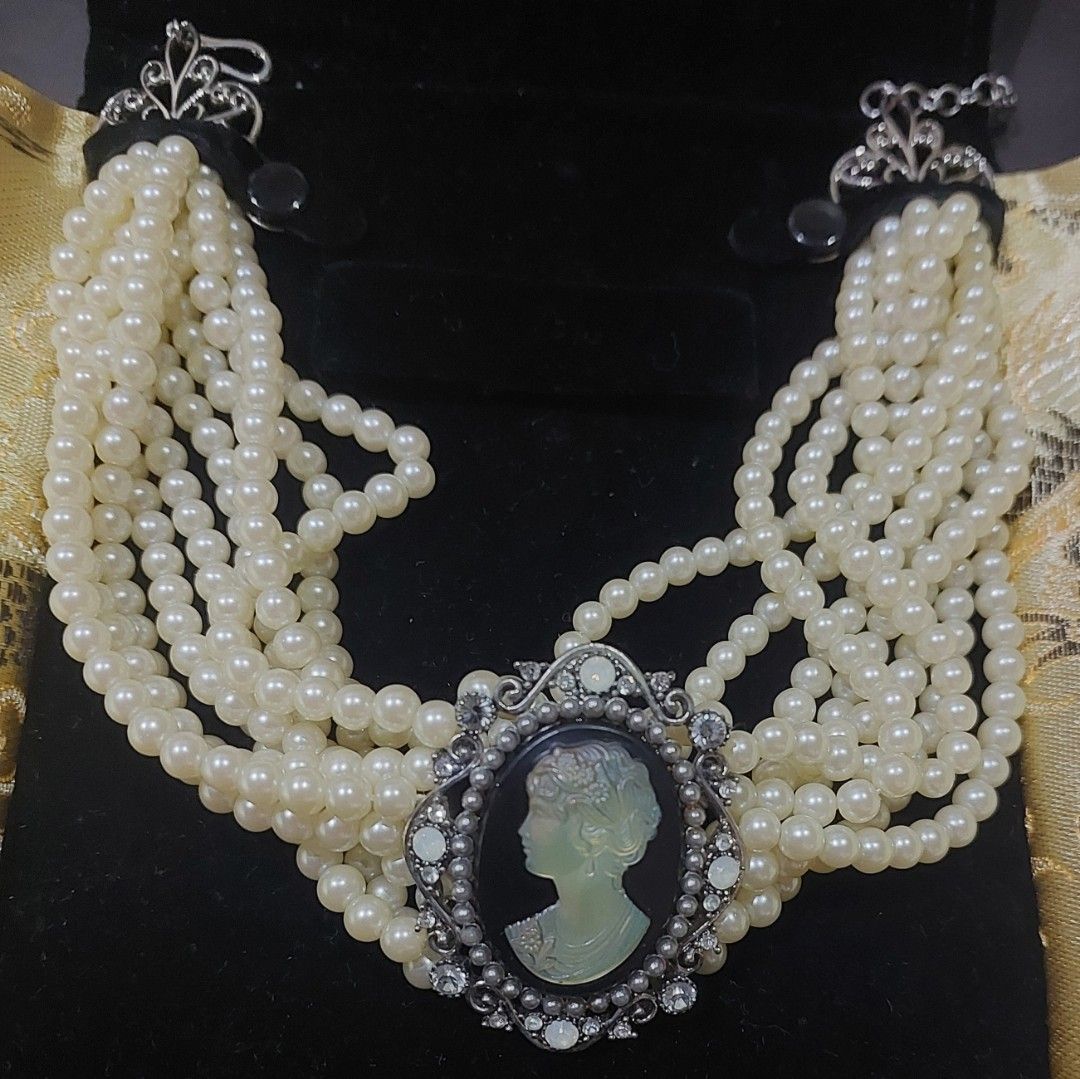 Multi-Strand Cameo Choker (Category: Necklaces) located in Makati City. Submitted by geesharma_08 (Listing ID 1460543476, Image 1). Description: A timeless artisanal statement piece, make this BRAND NEW Carolee Victorian-revival choker yours. Features a beautifully detailed vintage-style cameo center framed in intricate metalwork, and six elegant pearl strands. Perfect for adding a touch of dark academia, coquette, or royal-core elegance to your 