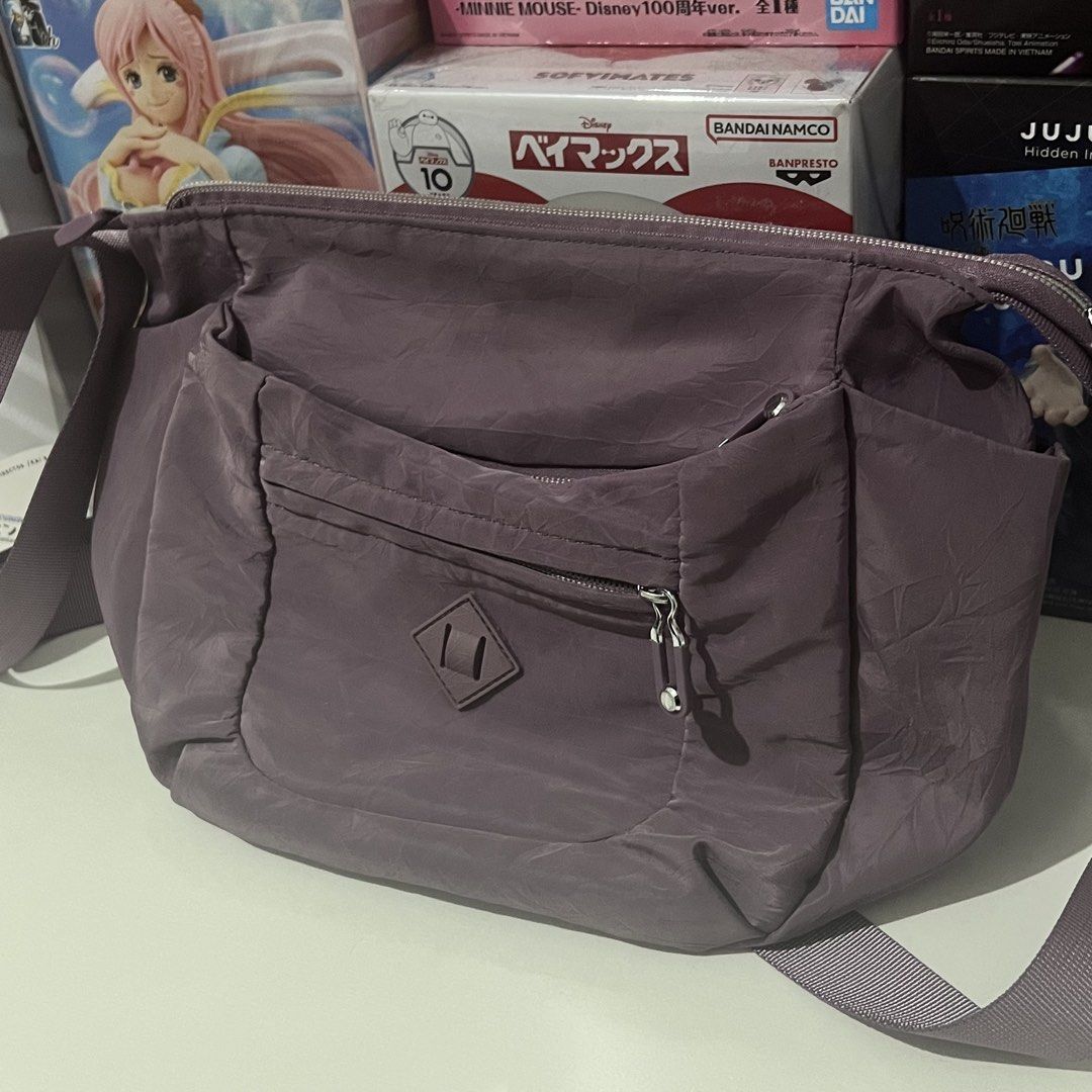 Muted Purple Kipling Inspired Cross Body Bag (Category: Cross-body Bags) located in Paranaque City. Submitted by songel.co (Listing ID 1460603812, Image 2). Description: Muted Purple Kipling Inspired Cross Body Bag No noticeable defects Signs of usage can only be seen on the seams near the strap (see pictures) Manage expectations Bought in Singapore Loc: Sun Valley Parañaque Mod: J&T / Lalamove Mop: Gcash / BDO .