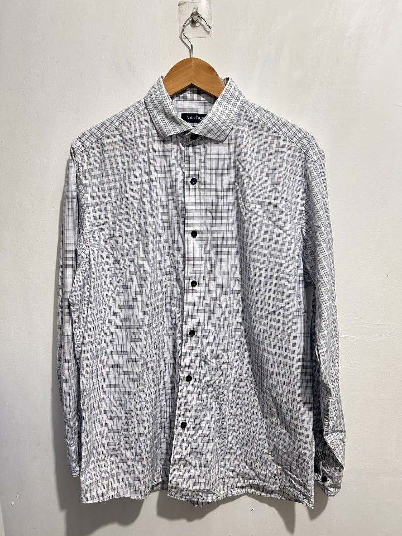 Nautica long-sleeve button-up shirt (Category: Tshirts & Polo Shirts ) located in Rizal. Submitted by thrift_finds_739 (Listing ID 1460586974, Image 1). Description: NO ISSUE | ALL BUTTONS ARE INTACT Color rate 9/10 Size : Medium L: 29 W: 23 Please manage your expectations — we open premium bulk ukay bundles shipped directly from the US! 🇺🇸.