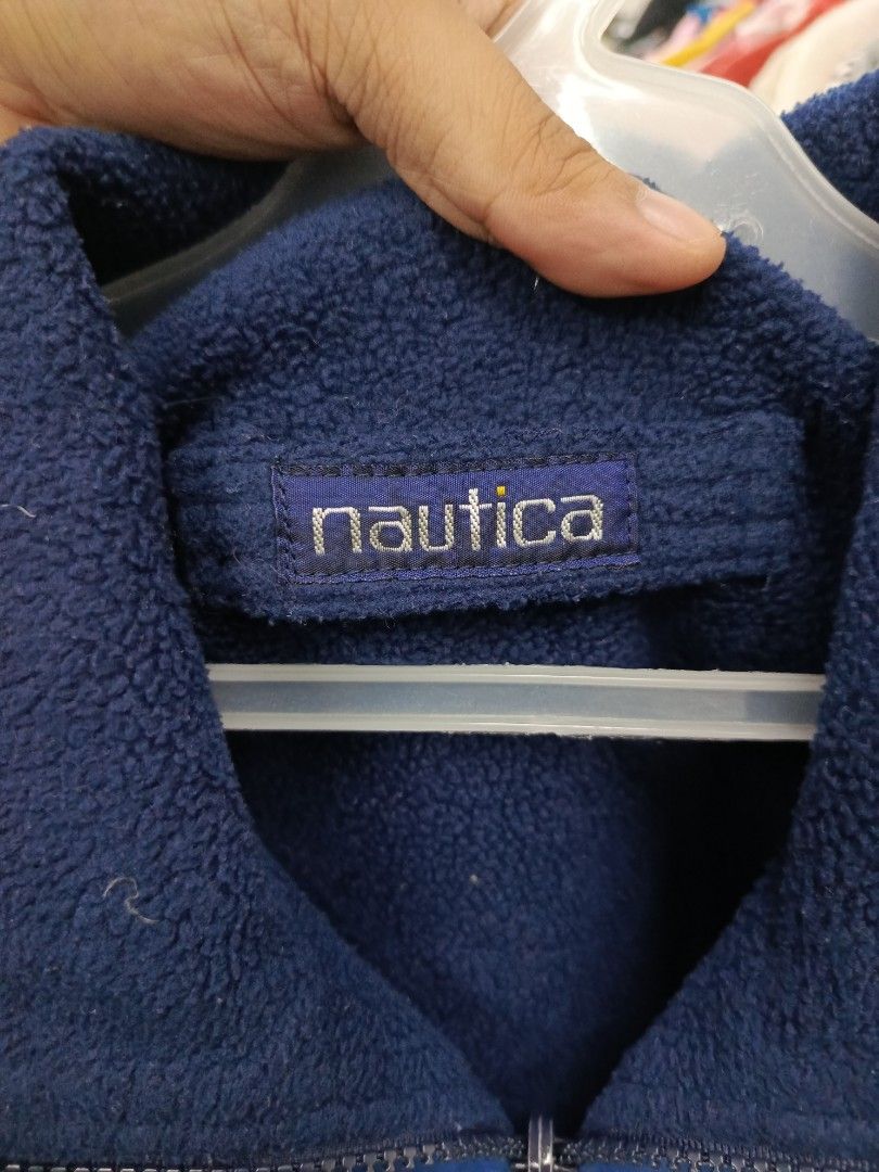Nautica Reversible Fleece Lined Jacket (Category: Coats, Jackets and Outerwear) located in Cabatuan. Submitted by penthegreat (Listing ID 1460711108, Image 2). Description: - Classic Nautica jacket - Color: Blue with red and white stripes - Reversible design: One side is the classic blue, the other is a cozy fleece lining - Full zip closure - Two side pockets - Ideal for cooler weather and casual wear.