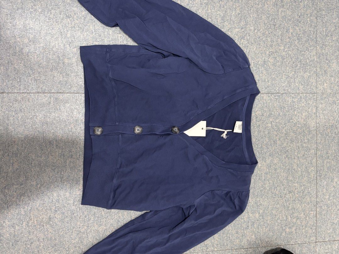 Navy Blue Button Up Cardigan (Category: Coats, Jackets and Outerwear) located in Cavite. Submitted by icy______ (Listing ID 1460691028, Image 1). Description: - Navy blue cardigan - V-neckline - Button-up front - Long sleeves - Ribbed cuffs and hem - Brand new with tag attached - Versatile for layering or standalone wear.