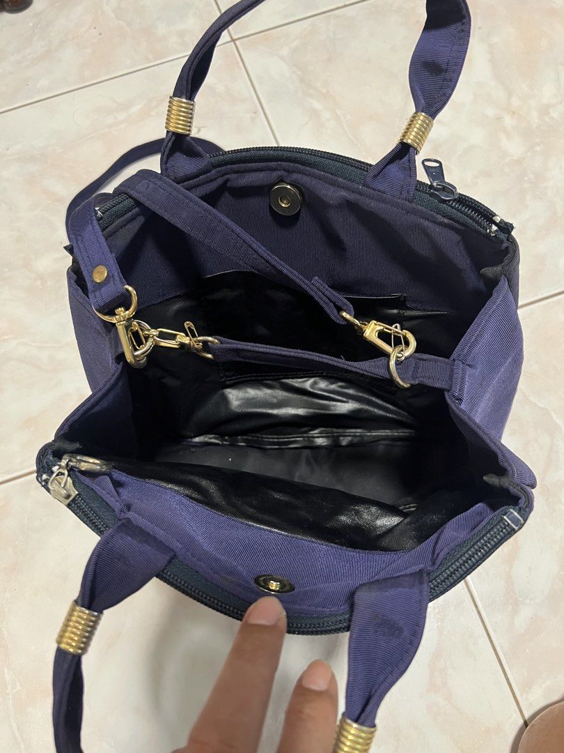 Navy blue tote/crossbody bag (Category: Cross-body Bags) located in Manila. Submitted by rlab_japan_thrift (Listing ID 1460590995, Image 3). Description: Vintage Dark Navy Blue Fabric Convertible Tote / Crossbody Bag 👜✨ Chic vintage Japanese bag in a rich dark navy blue fabric featuring a subtle fabric rose accent on the front. Offers versatile 2-way carrying—use the dual top handles or wear it as a crossbody with the long adjustable strap! * Co