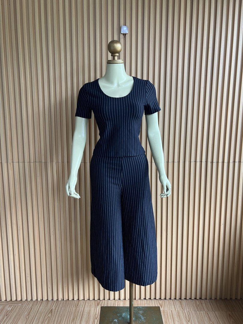 Navy Pinstripe Culotte Jumpsuit (Category: Jumpsuits) located in Lipa City. Submitted by thyra06 (Listing ID 1460650302, Image 2). Description: - Black coordswith white pinstripes - Short sleeves - Culotte-style pants - Simple scoop neckline - Comfortable and chic for everyday wear - Versatile for dressing up or down.