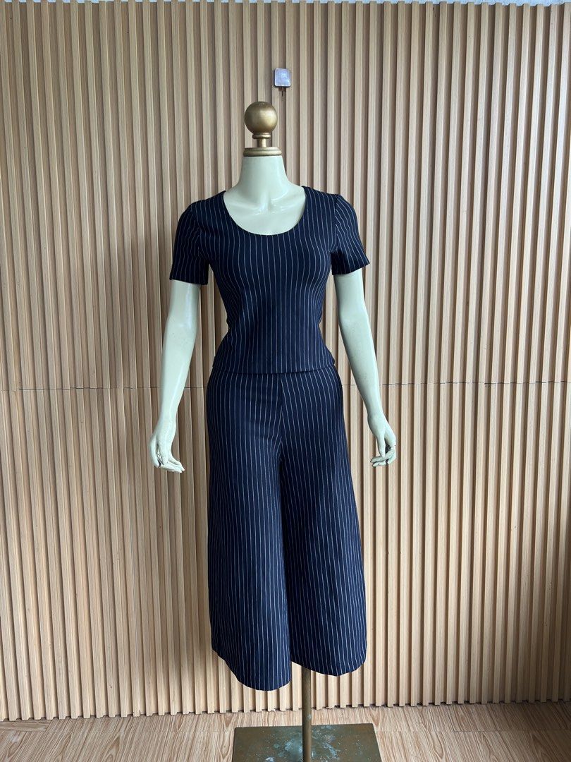 Navy Pinstripe Culotte Jumpsuit (Category: Jumpsuits) located in Lipa City. Submitted by thyra06 (Listing ID 1460650302, Image 1). Description: - Black coordswith white pinstripes - Short sleeves - Culotte-style pants - Simple scoop neckline - Comfortable and chic for everyday wear - Versatile for dressing up or down.