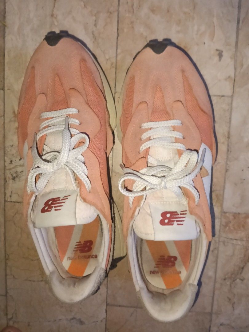 New Balance 327 size 11 (Category: Sneakers) located in Quezon City. Submitted by spicyphoenix (Listing ID 1460713617, Image 2). Description: - New Balance 327 sneakers - Color: Orange and Pink - Upper: Suede and Mesh - Features: Classic 'N' logo on side, grippy rubber sole - Laces: White - Condition: Gently worn, with plenty of life left. Please check photos for detailed condition. size 11 negotiable.