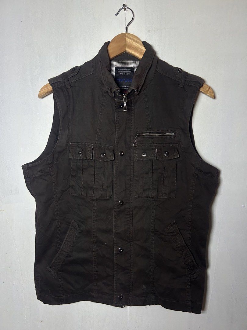Nicole Club Men's Brown Utility Jacket (Category: Coats, Jackets and Outerwear) located in Tuguegarao City. Submitted by thrift_ni_boy (Listing ID 1460536724, Image 2). Description: - Brown utility jacket from Nicole Club - Features multiple front pockets, some with zippers - Button-up closure - Stand-up collar design - Versatile: can be worn as a vest - Ideal for casual wear.