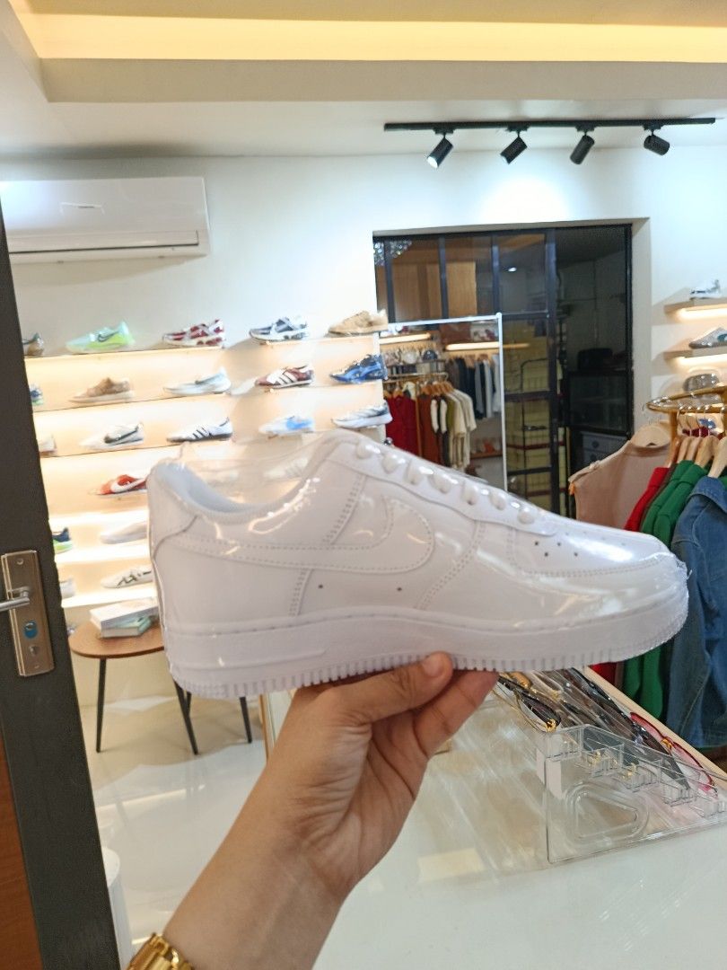 Nike Air Force 1 Low White Patent Leather (Category: Sneakers) located in Bulacan. Submitted by francia.luxe_237 (Listing ID 1460599399, Image 1). Description: -Authentic Classic white Nike Air Force 1s - Low-top silhouette - Shiny patent leather finish - Includes original laces - Essential for any sneaker collection - Easy to style with any outfit - Perfect for casual wear.