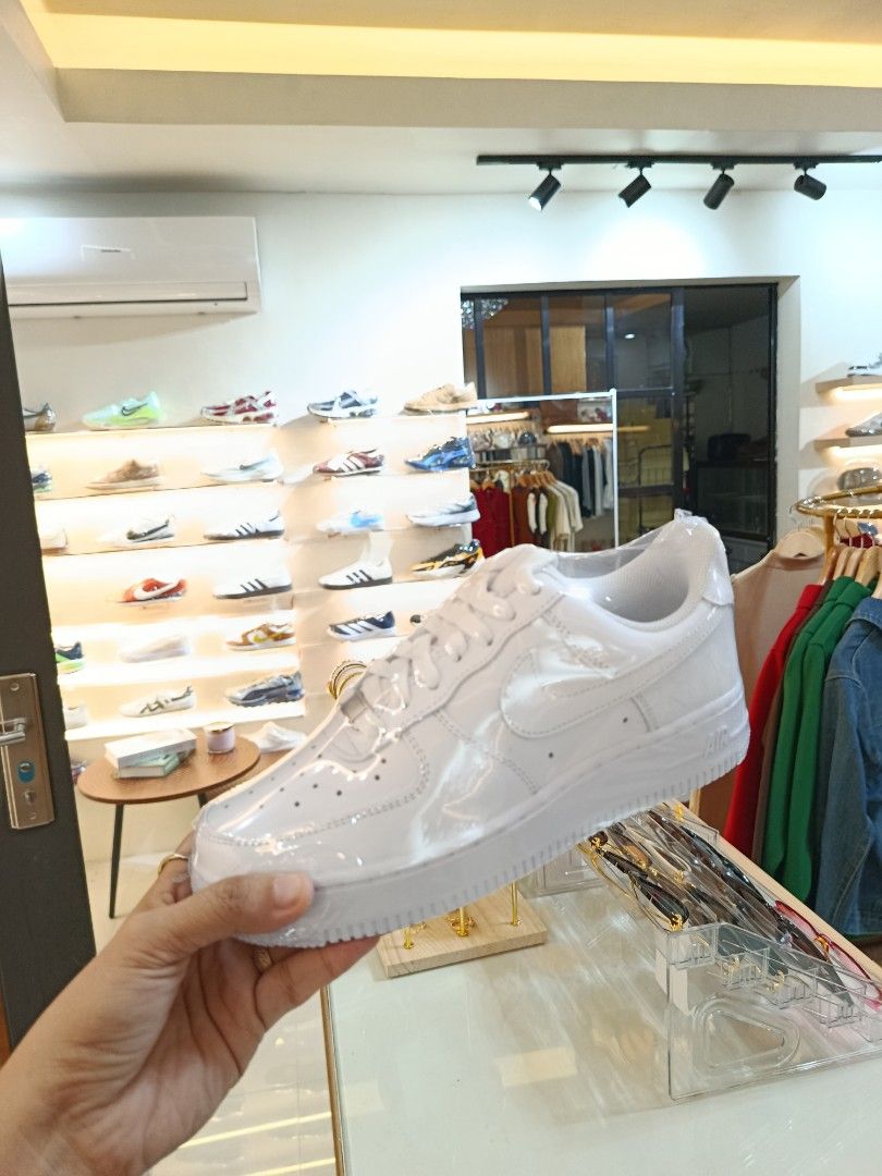 Nike Air Force 1 Low White Patent Leather (Category: Sneakers) located in Bulacan. Submitted by francia.luxe_237 (Listing ID 1460599399, Image 3). Description: -Authentic Classic white Nike Air Force 1s - Low-top silhouette - Shiny patent leather finish - Includes original laces - Essential for any sneaker collection - Easy to style with any outfit - Perfect for casual wear.