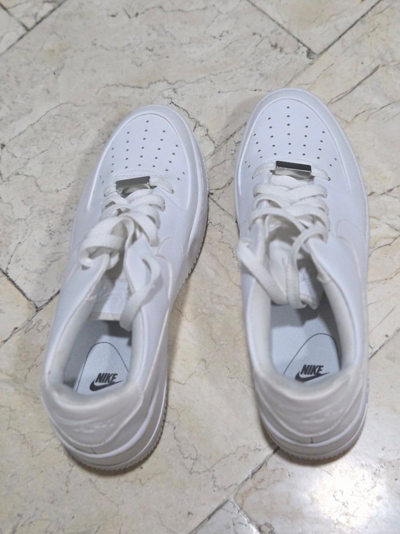 Nike Air Force 1 White Sneakers (Category: Sneakers) located in Manila. Submitted by c__rabaino (Listing ID 1460691548, Image 2). Description: - Classic white Nike Air Force 1 sneakers - Low-top version - Clean and versatile design - Ideal for everyday wear - Engineered for all-day comfort - Iconic and must-have kicks Used once. Still looks new. MOP: GCash or any digital bank transfer.