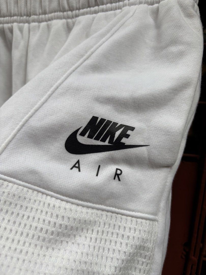 Nike Air White Shorts Size S (Category: Shorts) located in Manila. Submitted by thriftkibs (Listing ID 1460651361, Image 3). Description: - White Nike Air shorts - Size S - Elastic waistband - Mesh panel details on sides - Made in China - Ideal for workouts or casual wear.