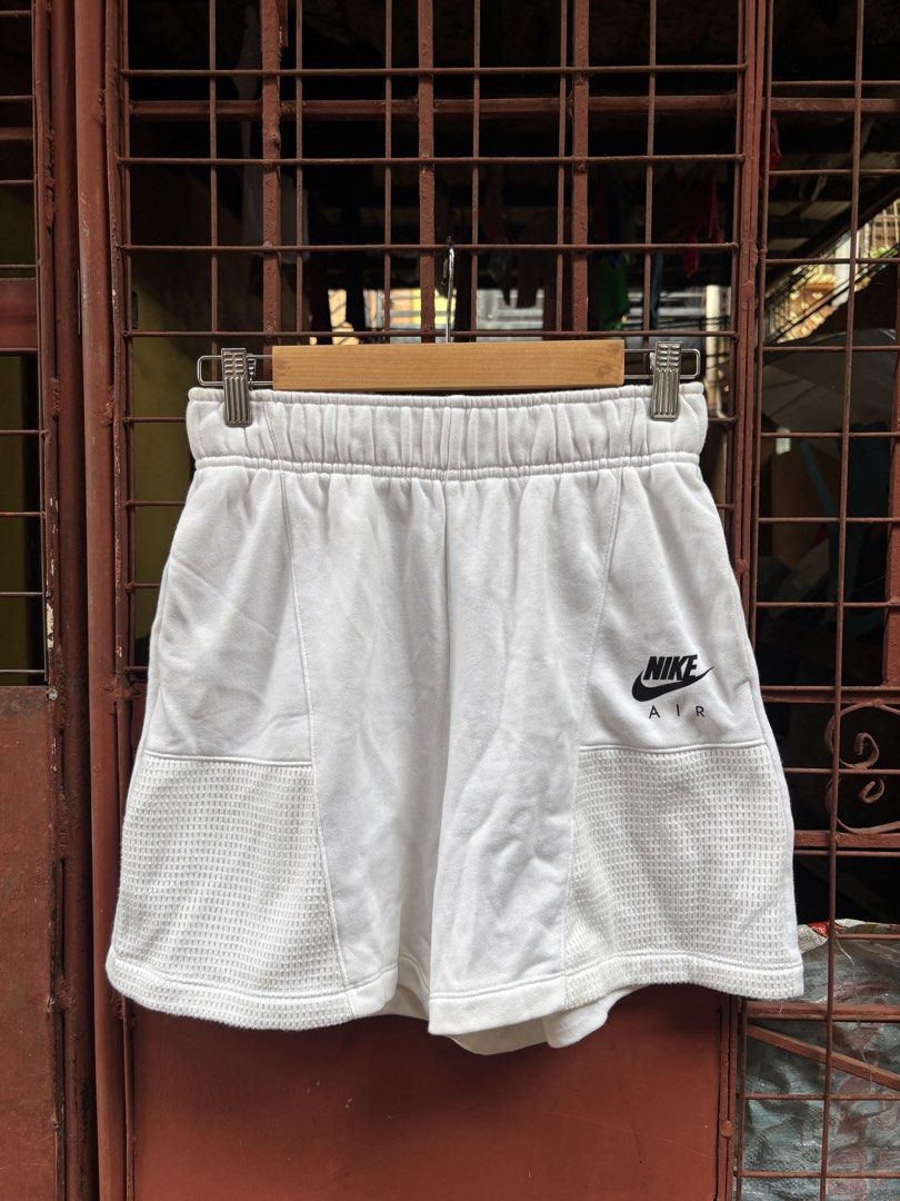 Nike Air White Shorts Size S (Category: Shorts) located in Manila. Submitted by thriftkibs (Listing ID 1460651361, Image 1). Description: - White Nike Air shorts - Size S - Elastic waistband - Mesh panel details on sides - Made in China - Ideal for workouts or casual wear.