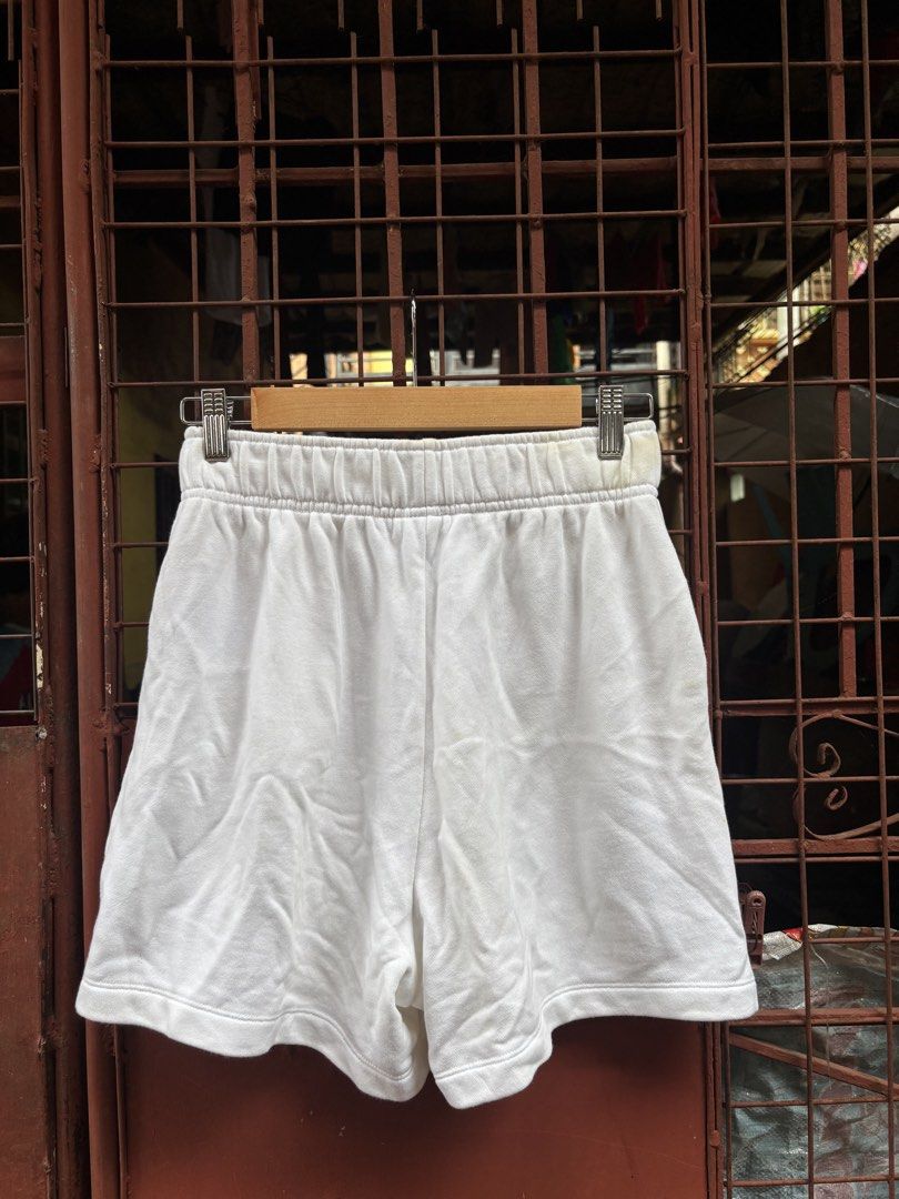 Nike Air White Shorts Size S (Category: Shorts) located in Manila. Submitted by thriftkibs (Listing ID 1460651361, Image 2). Description: - White Nike Air shorts - Size S - Elastic waistband - Mesh panel details on sides - Made in China - Ideal for workouts or casual wear.
