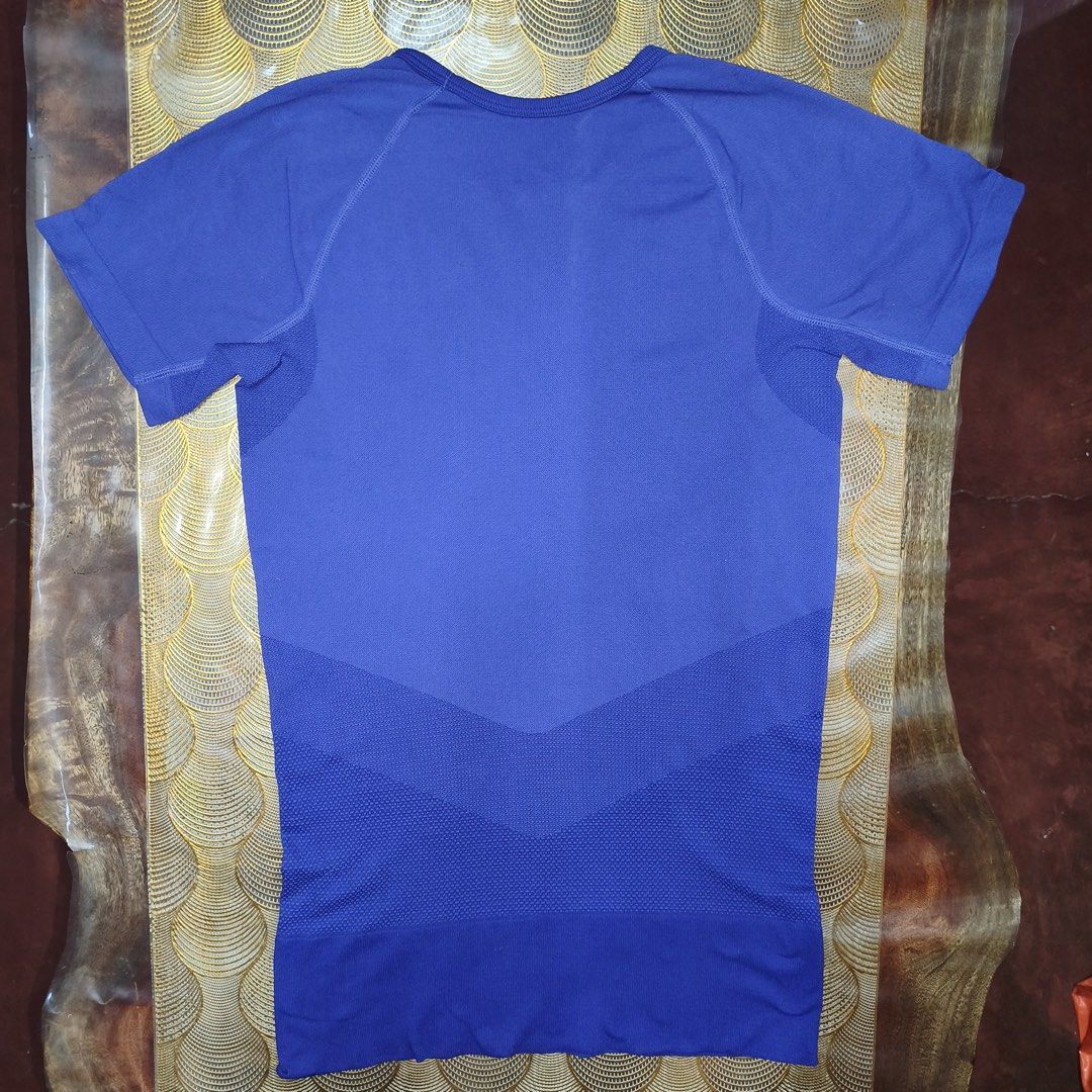 Nike dri-fit athletic shirt (Category: Activewear) located in Antipolo. Submitted by swertecat (Listing ID 1460532633, Image 2). Description: Like new Super stretchy Small on tag Violet ang color sa actual. 16x26.