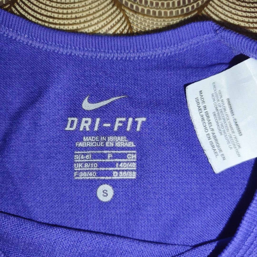 Nike dri-fit athletic shirt (Category: Activewear) located in Antipolo. Submitted by swertecat (Listing ID 1460532633, Image 3). Description: Like new Super stretchy Small on tag Violet ang color sa actual. 16x26.
