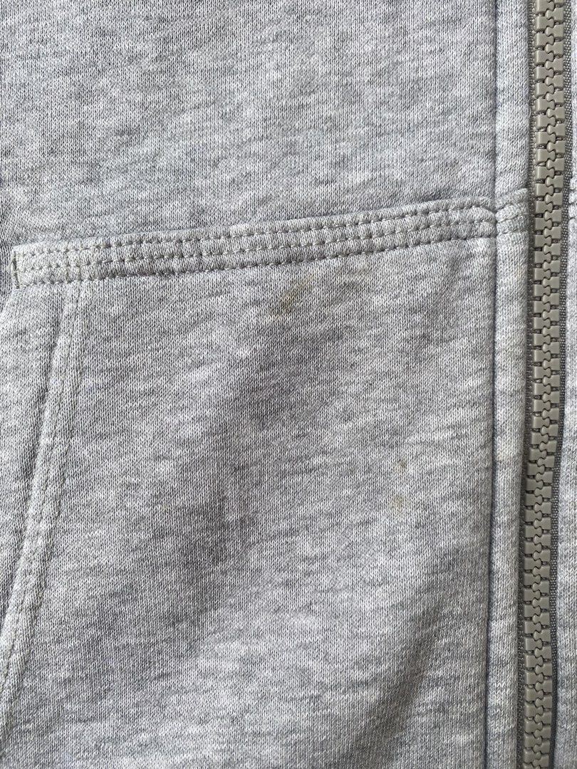 Nike Grey Zip-Up Hoodie (Category: Coats, Jackets and Outerwear) located in Aroroy. Submitted by derz.archive (Listing ID 1460681471, Image 3). Description: - Grey Nike zip-up hoodie - Size: Large - Ideal for casual everyday wear -COLOR RATE: 9/10 -ISSUE: YELLOW STAIN (NEED RE-WASH) -WIDTH: 21 -LENGTH: 27.