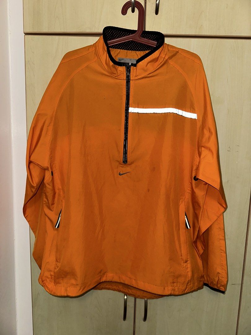Nike half zip windbreaker jacket (Category: Coats, Jackets and Outerwear) located in Quezon City. Submitted by mancave_stuff (Listing ID 1460585000, Image 2). Description: -Nike half zip windbreaker jacket -yellow orange hue -half reflective stripe across chest -size XL: W23” x L31” -adjustable waist band -Super lightweight -Equipped with breathable mesh interior -Issues: Small reflective strip in the back is gone and need wash (last pic).