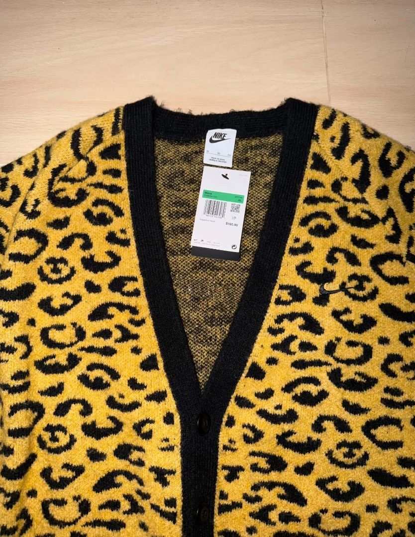 Nike Leopard Print Cardigan Sweater (Category: Coats, Jackets and Outerwear) located in Cainta. Submitted by hermosooo (Listing ID 1460714235, Image 3). Description: - Eye-catching yellow and black leopard print - Cozy, fuzzy material - Stylish black trim and cuffs - Functional front button closure - Estimated size: Medium (M) - Perfect statement piece to elevate your style.